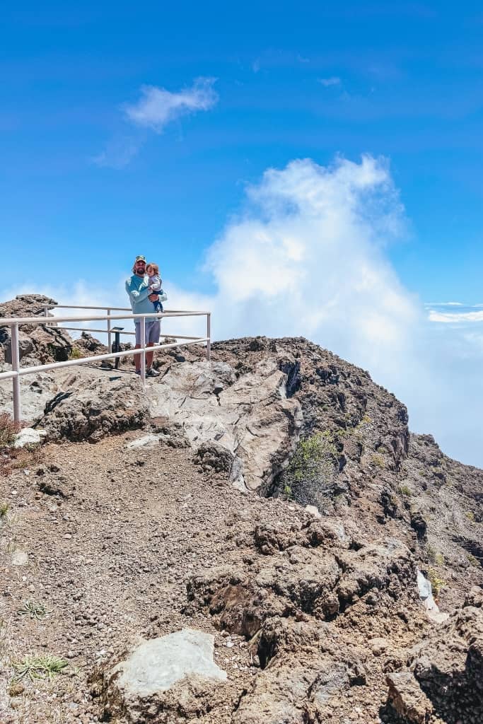 a dad and baby at one of the lookouts at haleakala national park