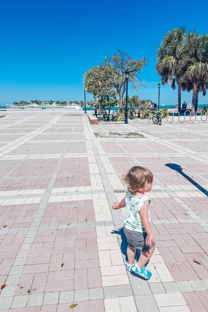kid running in mallory square in key west