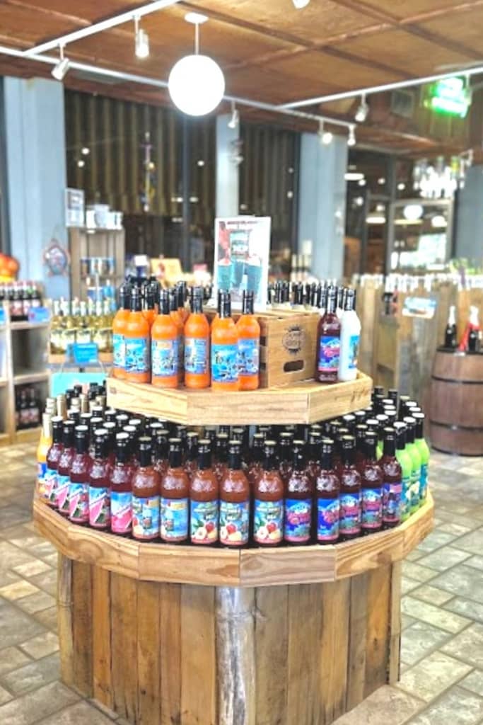 several wine bottles on display for purchase on two tiers at a winery in st pete beach florida