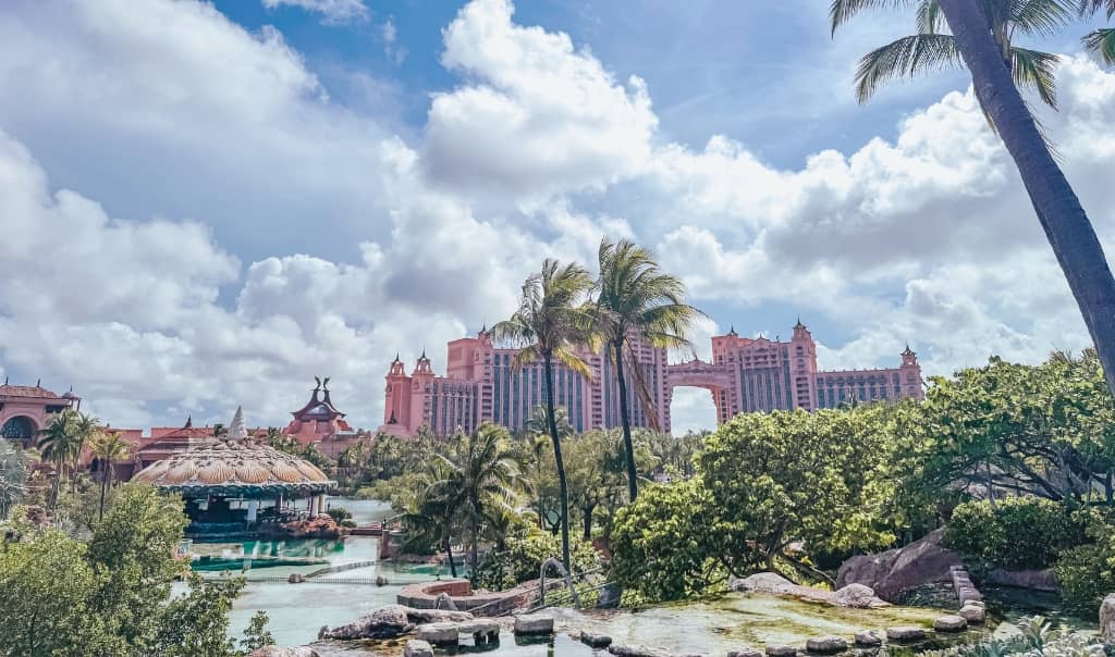 the royal towers at atlantis on a sunny day with palm trees on the side
